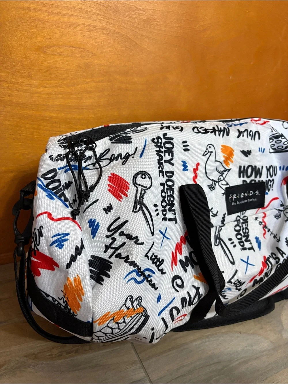 FRIENDS White Graphic Duffle with Multicolor Sketch Prints